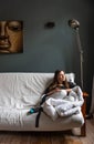 Portrait of an attractive thirty year old girl on her couch in the morning Royalty Free Stock Photo