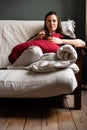 Portrait of an attractive thirty year old girl on her couch in the morning Royalty Free Stock Photo