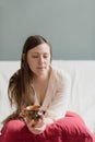 Portrait of an attractive thirty year old girl on her couch in the morning Royalty Free Stock Photo