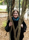 Portrait of an attractive thirty year old white woman with glasses smiling in a park background Royalty Free Stock Photo