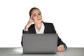 Portrait of attractive thoughtful young business woman in formal clothes isolated on white background sitting on desk and working Royalty Free Stock Photo