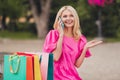 Portrait of attractive trendy cheerful carefree woman talking on phone going shopping store on fresh air outdoors Royalty Free Stock Photo