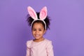 Portrait of attractive trendy cheerful cute sweet pre-teen girl wear bunny ears isolated over bright purple violet color Royalty Free Stock Photo