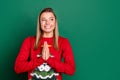 Portrait of attractive trendy cheerful girl praying looking aside copy space idea isolated over green color background Royalty Free Stock Photo