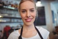 Portrait of attractive waitress at cafe