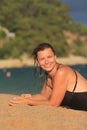 Portrait of attractive wet woman in swimsuit on sandy beach Royalty Free Stock Photo