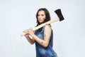 Portrait of an attractive woman with an axe. in the studio on a white background Royalty Free Stock Photo