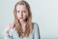 Pretty beautiful woman biting glasses in studio