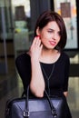 Portrait attractive woman with a briefcase in a mall Royalty Free Stock Photo