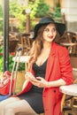 Portrait of attractive woman in cafe outdoors Royalty Free Stock Photo