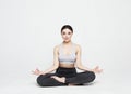 Portrait of attractive woman doing yoga, pilates over light grey background. Healthy lifestyle and sports concept. Royalty Free Stock Photo