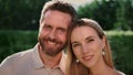 Portrait of attractive woman and handsome man smiling at camera outdoors Royalty Free Stock Photo