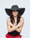 Portrait of an attractive woman in a hat with a large brim. photo shoot in the studio on a white background Royalty Free Stock Photo