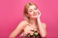 Portrait of attractive woman with pink rose. Beautiful fashion girl, headshot portrait. Perfume cosmetics concept Royalty Free Stock Photo