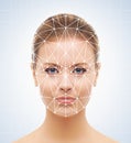 Portrait of attractive woman with a scnanning grid on her face. Face id, security, facial recognition. Royalty Free Stock Photo