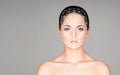 Portrait of attractive woman with a scnanning grid on her face. Face id, security, facial recognition, future technology