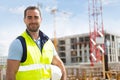 Portrait of an attractive worker on a construction site