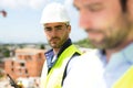 Portrait of an attractive worker on a construction site