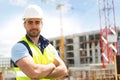 Portrait of an attractive worker on a construction site