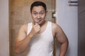 Man Brushing Teeth in Bathroom Royalty Free Stock Photo