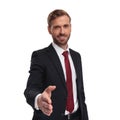 Portrait of attractive young businessman giving a hand shake Royalty Free Stock Photo