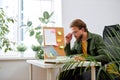 Portrait of attractive young businessman using laptop computer at office desk Royalty Free Stock Photo