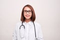 Portrait of an attractive young female asian doctor in white coat Royalty Free Stock Photo