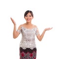Attractive cheerful young Indonesian lady wearing traditional co