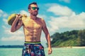 Portrait of an attractive young man on a tropical beach