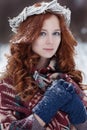 Portrait of attractive young redheaded woman in ethnic clothing