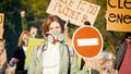 Portrait of Attractive Young Woman Activist Holding Stop Sign.