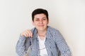 Portrait of an attractive woman sitting at desk, office interior. Smiling woman looking at camera Royalty Free Stock Photo