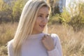 Portrait of attractive young woman in cropped white sweater