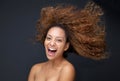 Portrait of an attractive young woman laughing with hair blowing Royalty Free Stock Photo