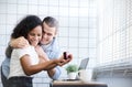 Portrait of Attractive young woman looking at engagement ring with smile while her boyfriend proposing indoors. Royalty Free Stock Photo