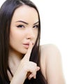 Portrait of attractive young woman with secret over white backgr Royalty Free Stock Photo