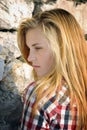 Portrait of attractive young woman and stone wall Royalty Free Stock Photo