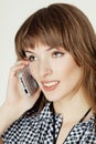 A portrait of attractive young women talking on cellular phone. Royalty Free Stock Photo