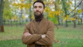 Portrait in autumn park outdoors city nature confident friendly happy Caucasian millennial 30s man guy father male Royalty Free Stock Photo