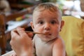 Portrait of a baby being fed