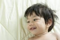 Portrait Baby Boy Asia Smile on Bed with space for text. Royalty Free Stock Photo