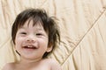 Portrait Baby Boy Asia Smile on Bed with space for text. Royalty Free Stock Photo