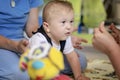 Portrait of a baby with cerebral palsy on physiotherapy in a children therapy center. Boy with disability has therapy by doing Royalty Free Stock Photo