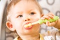 Portrait of baby cleaning teeth with toothbrush