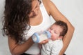 Baby drinking milk of her bottle