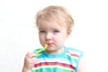 Portrait of baby eating porridge with spoon Royalty Free Stock Photo