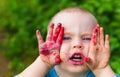 Portrait baby face dirty from blueberries Royalty Free Stock Photo