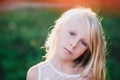 Portrait of a baby girl spinning in a field in sunset light Royalty Free Stock Photo