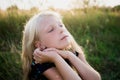 Portrait of a baby girl spinning in a field in sunset light Royalty Free Stock Photo