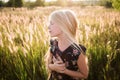 Portrait of a baby girl spinning in a field in sunset light Royalty Free Stock Photo